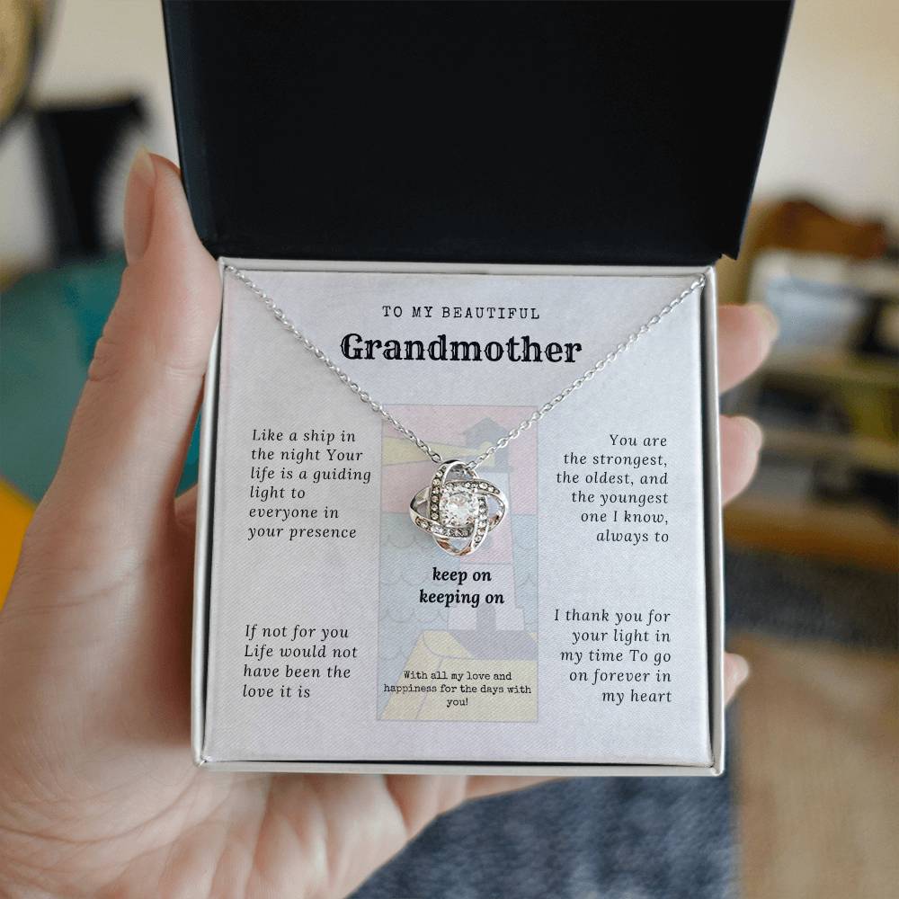 To my grandmother with message card and Love knot necklace (white gold finish), woman hand holding it in a two toned box - Sheer: your Luck - Sheerluck-art.com